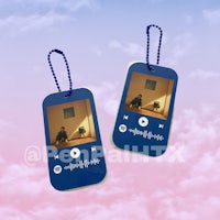 two dog tags with a picture of bts on them
